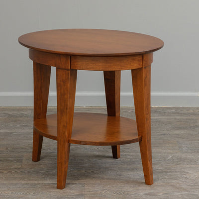 Oval end table in a warm cherry finish with four tapered legs and an oval lower display shelf