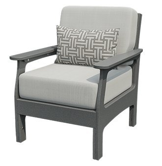 Gray poly patio club chair with blue deep-seat cushions and a patterned lumbar pillow on a wooden lakeside dock