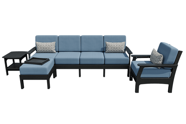 White poly patio sofa set with gray cushions, matching chair, ottoman with tray and side table on a city rooftop