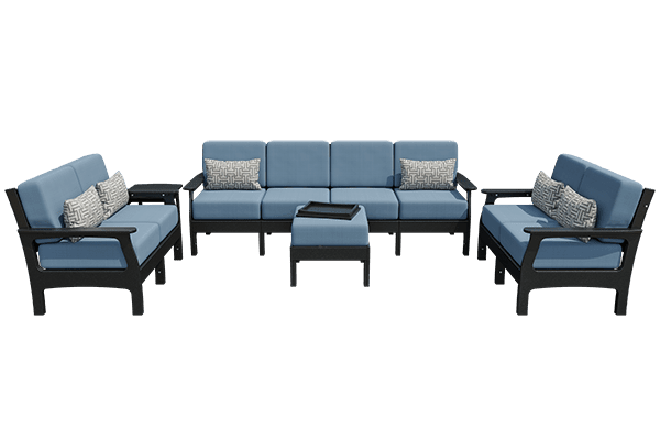 Gray poly patio set with white cushions: four seat sofa, two club chairs, tray ottoman and side tables indoors