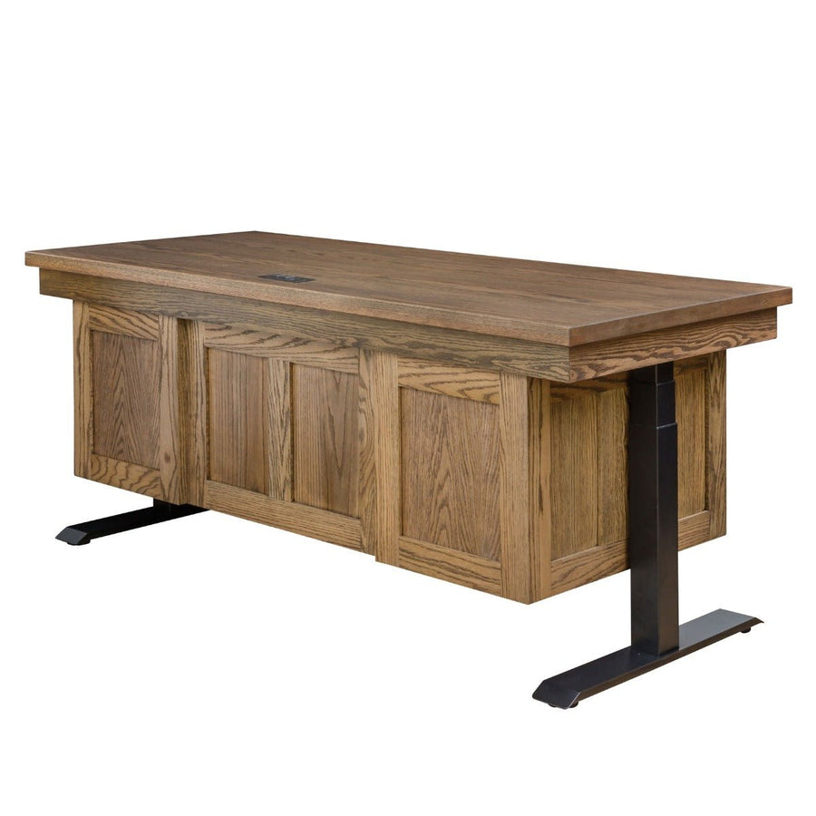 Back view of a double pedestal lift desk with raised oak panels, wire grommet and black electric lift legs on white