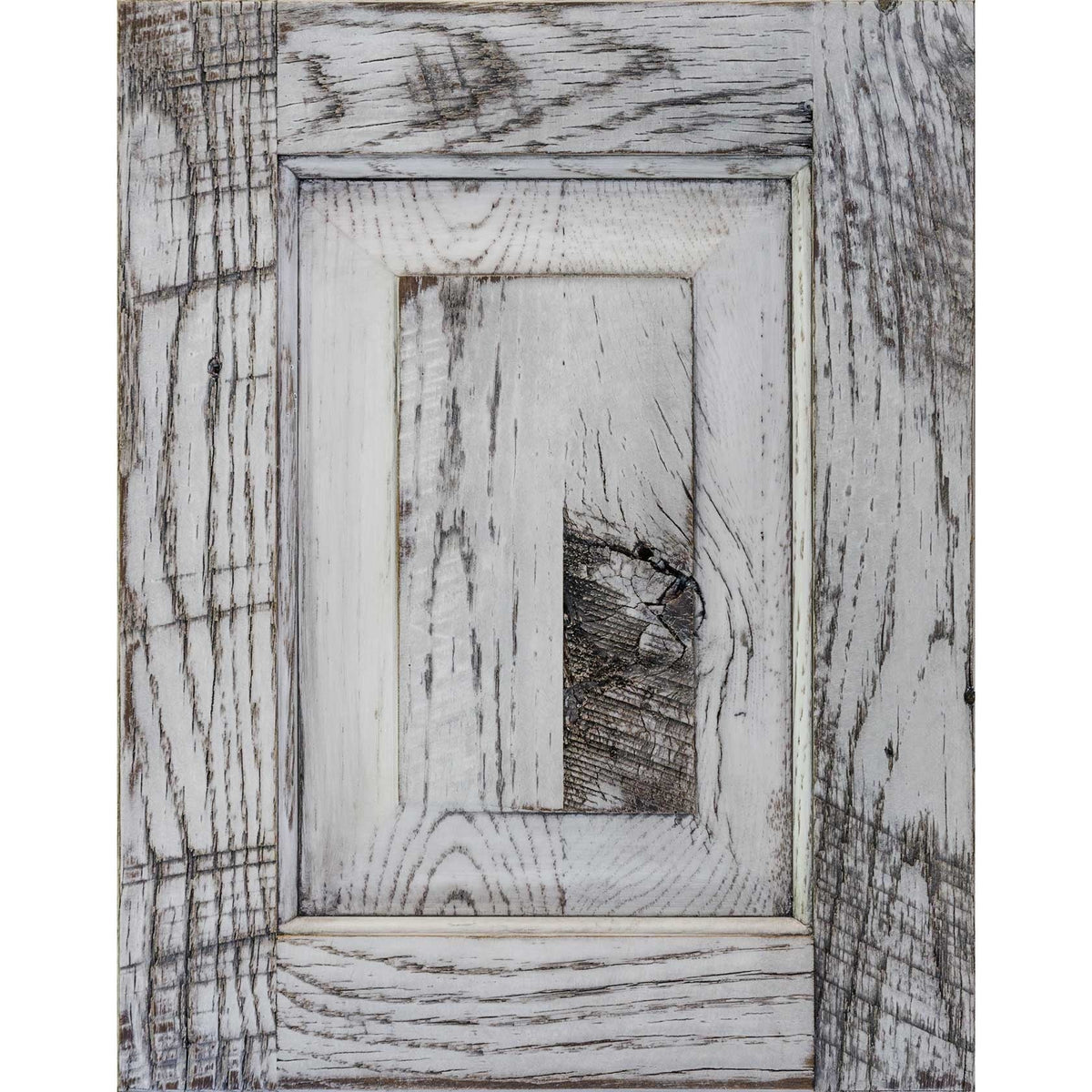 White paint with black glaze on barnwood door sample, weathered white boards with gray grain and knots