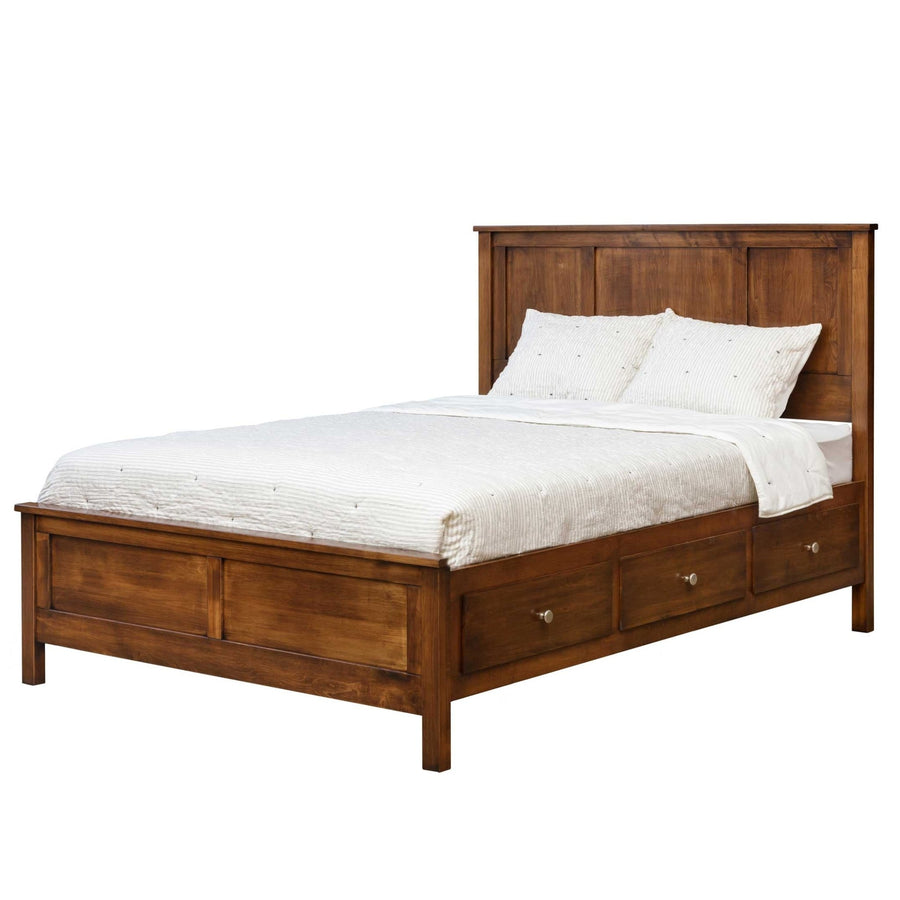 Panel low footboard captain storage bed with three underbed drawers and nickel knobs in warm brown wood